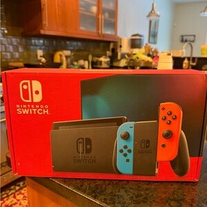 New in box Nintendo Switch Console - Bright Red and Blue